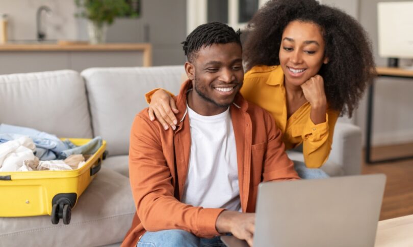 Couple booking airline tickets